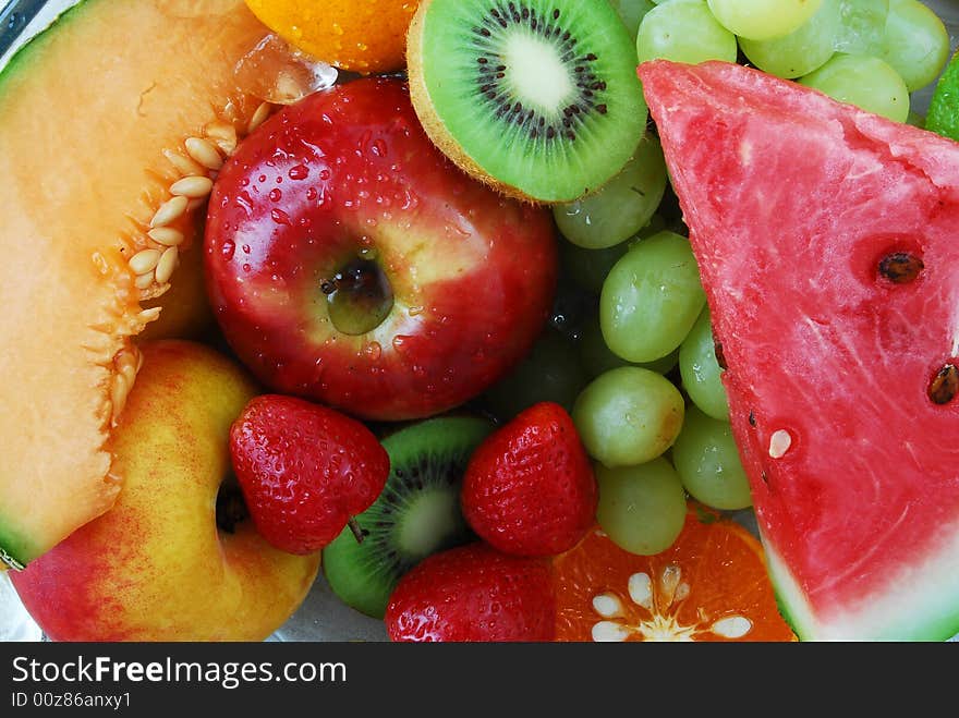 Colorful fresh group of fruits for a balanced diet. Black background. Look at my gallery for more fresh fruits and vegetables.