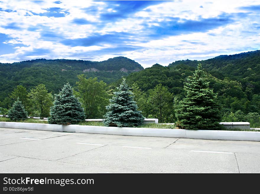 Mountain tops on background blue year sun