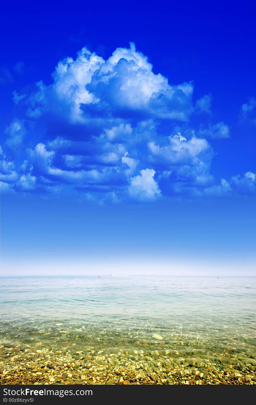 Wave on golden sea beach under year blue sky and cloud