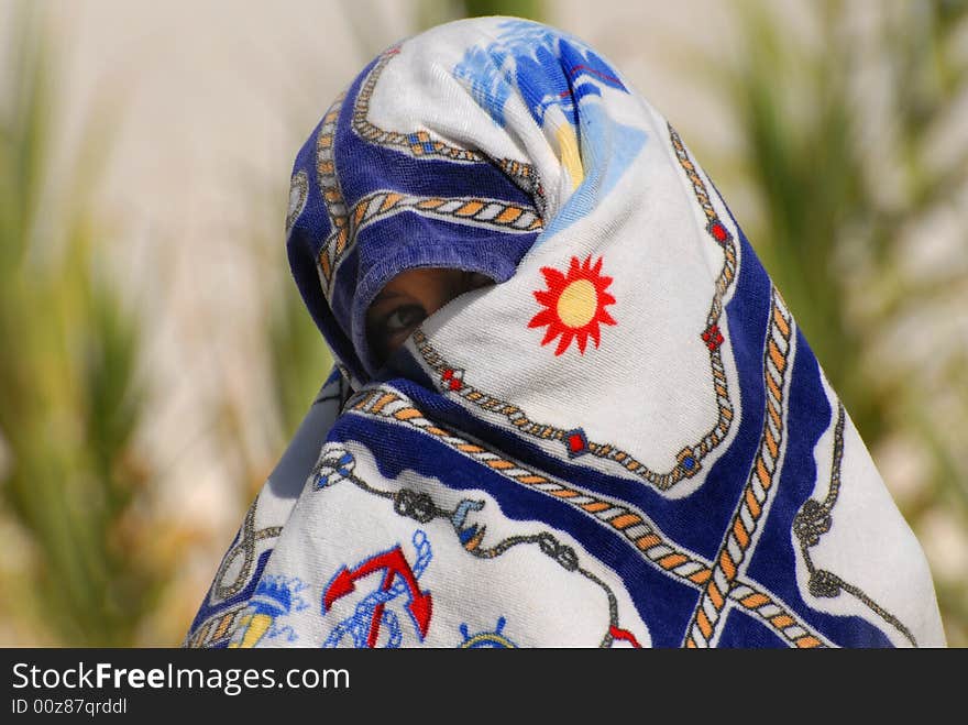 Boy wraps around a beach towel