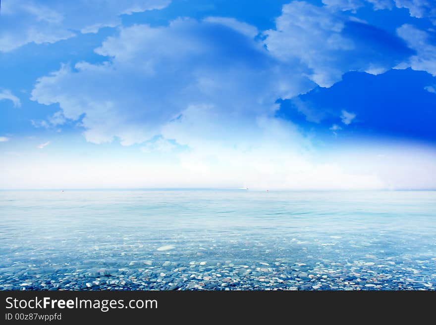 Wave on sea beach under year blue sky and cloud