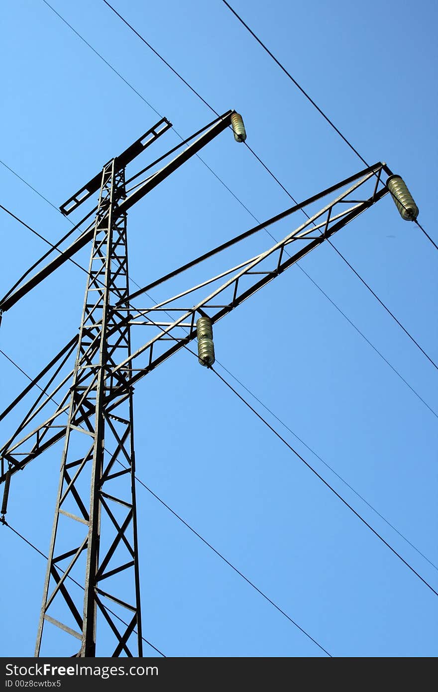 High voltage tower on blue sky