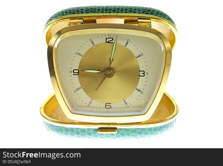 Old golden clock on white background