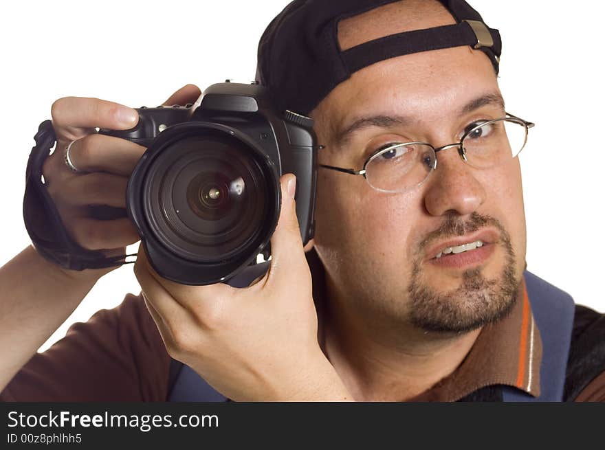 Young man with digital camera taking picture, focus on lens. Young man with digital camera taking picture, focus on lens