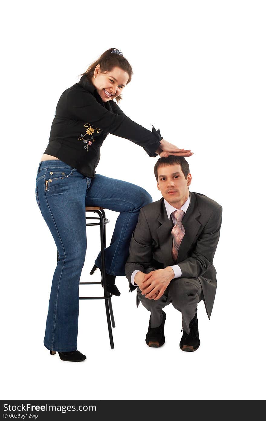 Girl's pressure on man sitting at her stool. Girl's pressure on man sitting at her stool