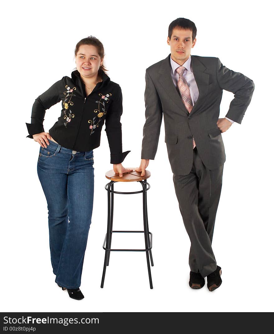 Girl with young man stands at stool. Girl with young man stands at stool