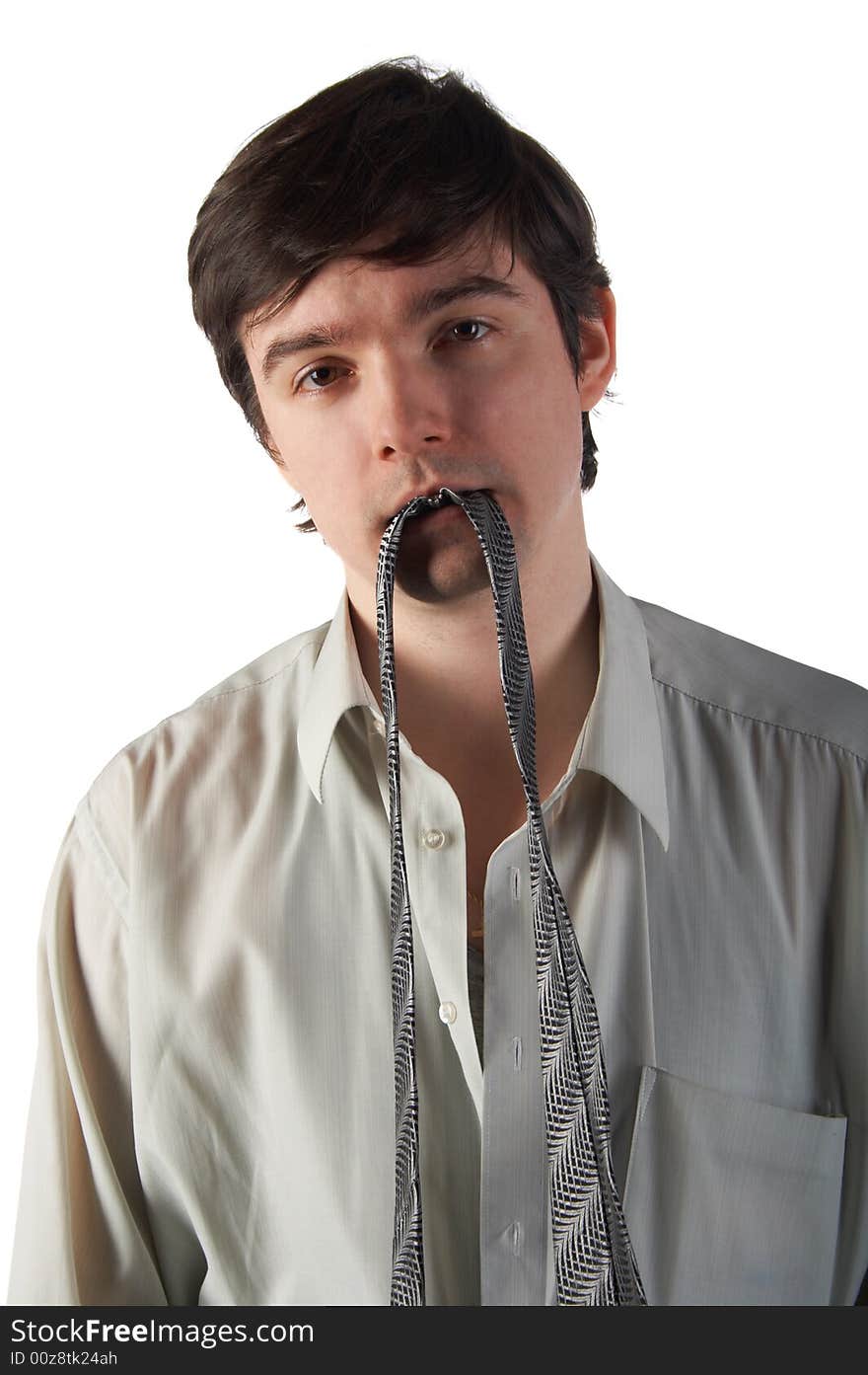 Young man hold necktie in teeth