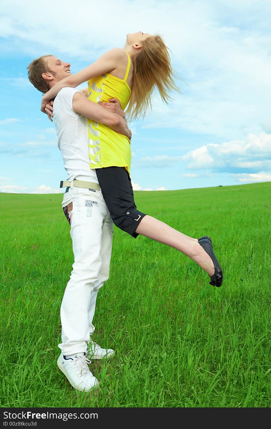 Young couple playing around in the nature