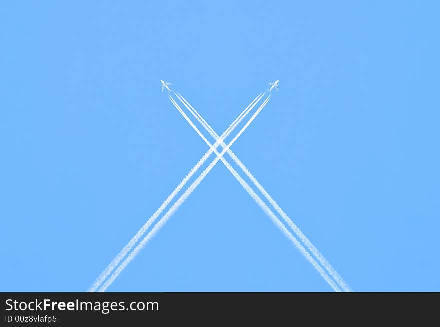 Airplanes crossing the blue sky