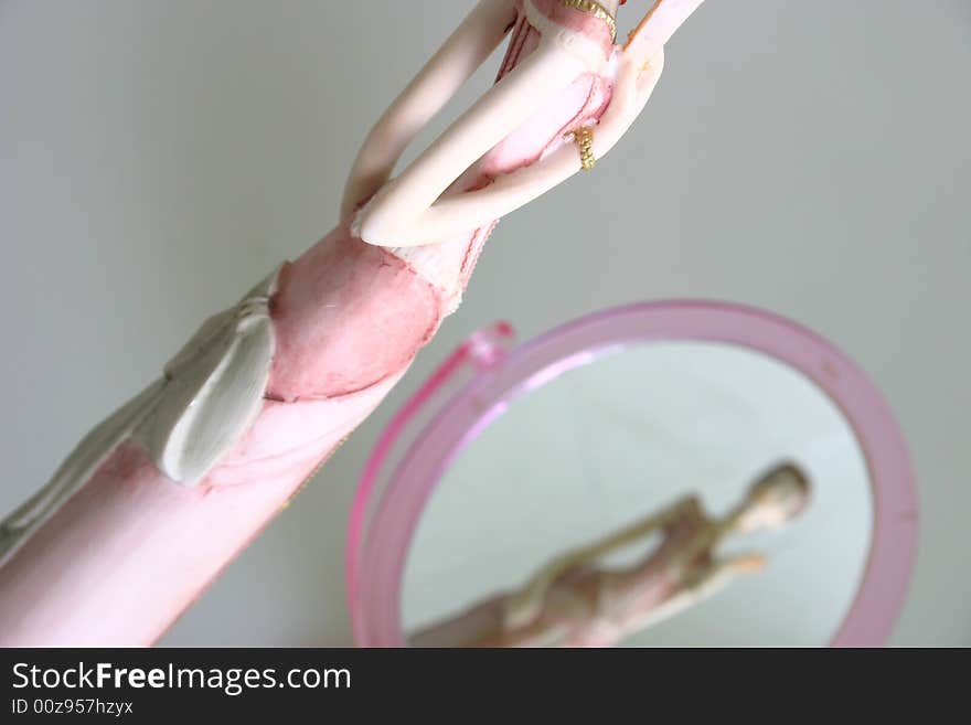 Woman is looking herself in mirror