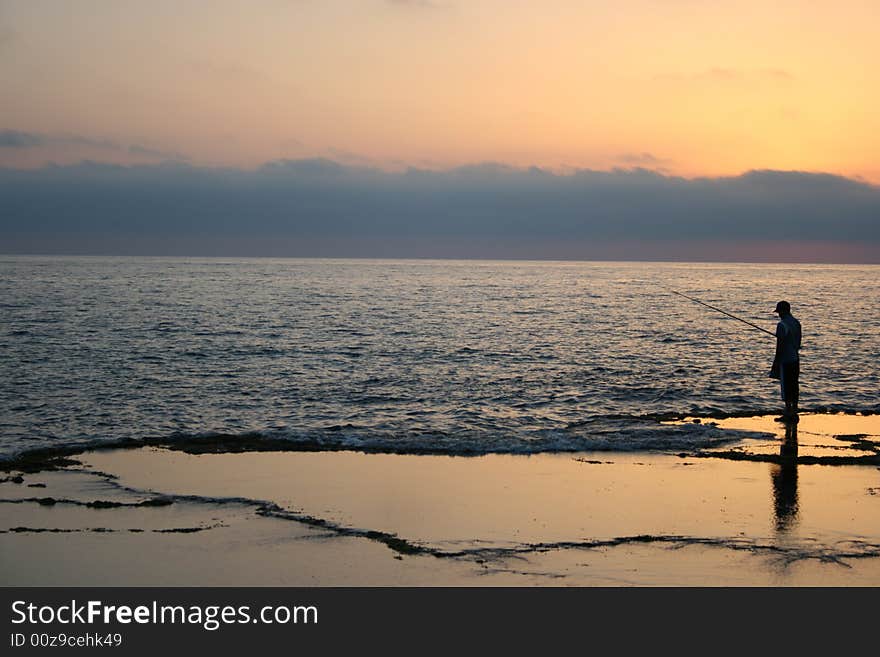 Fisherman At Sunset