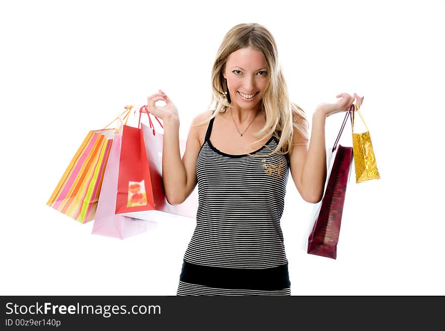 Happy Young woman holding bags on a white background