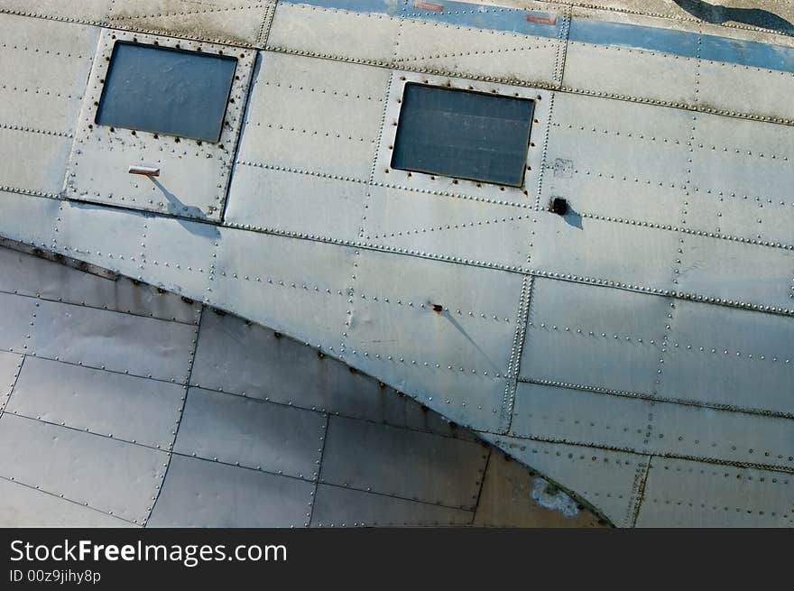 Details of fuselage of a series of IInd world war aircraft stored at airfield. Details of fuselage of a series of IInd world war aircraft stored at airfield