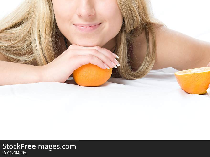 Portrait of young woman with two orange