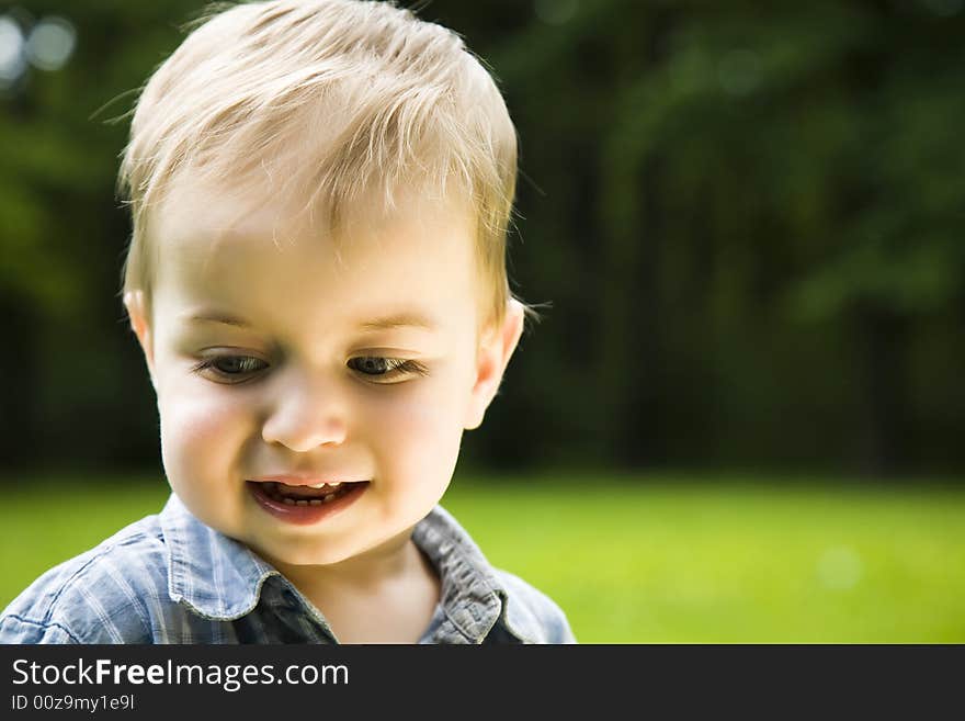 Happy Boy On Nature Background