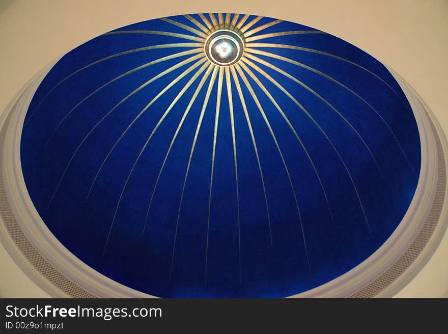 Close up on a blue glass cupola over white ceiling. Close up on a blue glass cupola over white ceiling