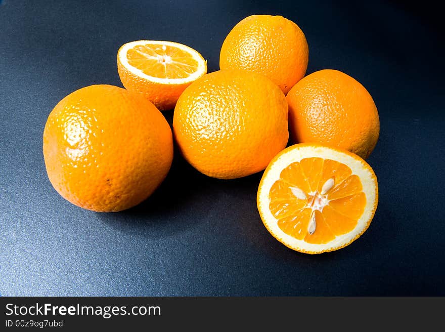 Orange fruits on the black background. Orange fruits on the black background