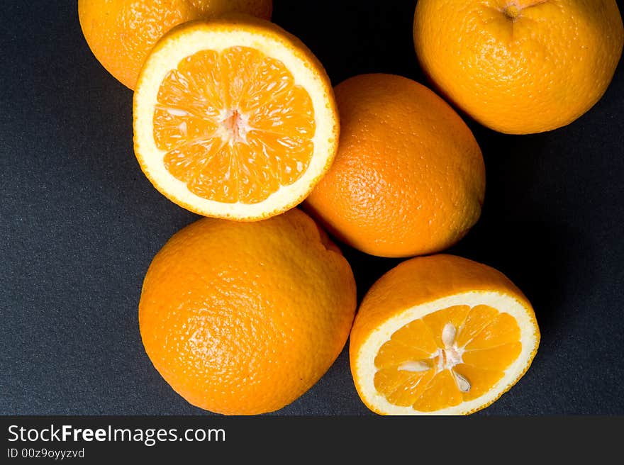 Orange fruits on the black background. Orange fruits on the black background