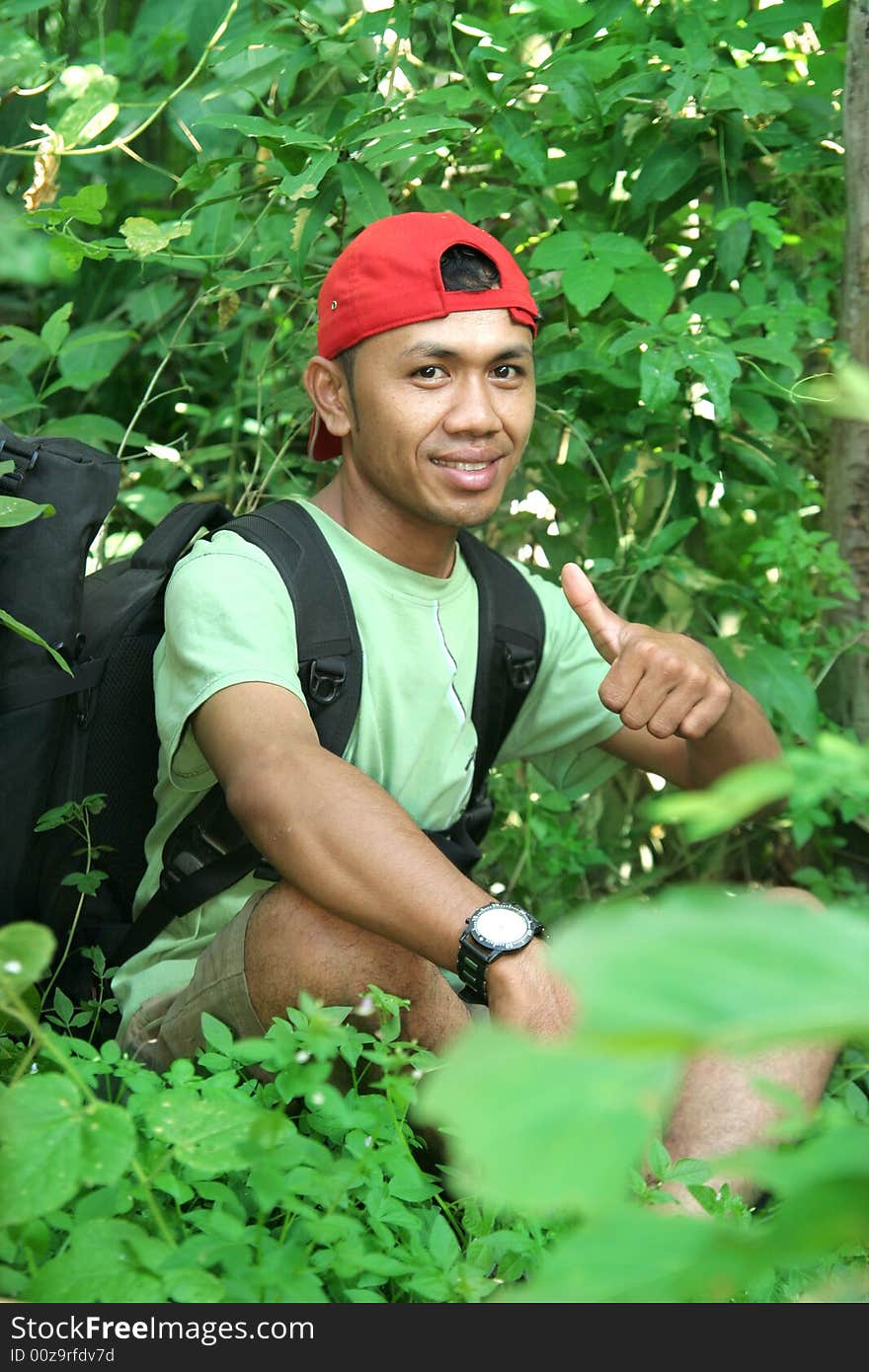 Hiking backpacker in the forest