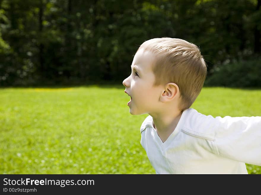 Running Boy Outdoors. Happy Childhood. Running Boy Outdoors. Happy Childhood.