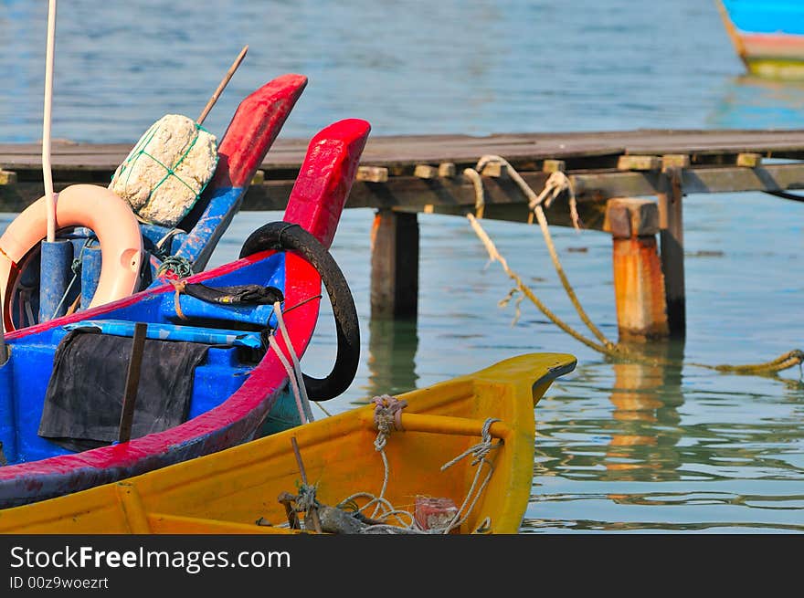 Fishing boat docked by the sea. Fishing boat docked by the sea