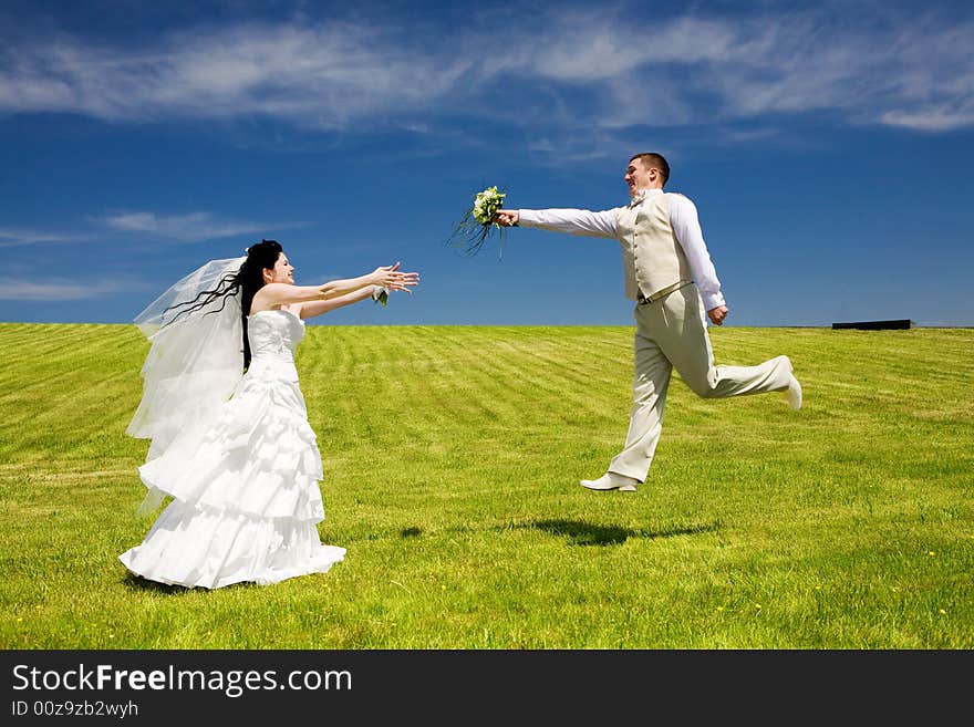 Groom gives bouquet to bride. Groom gives bouquet to bride