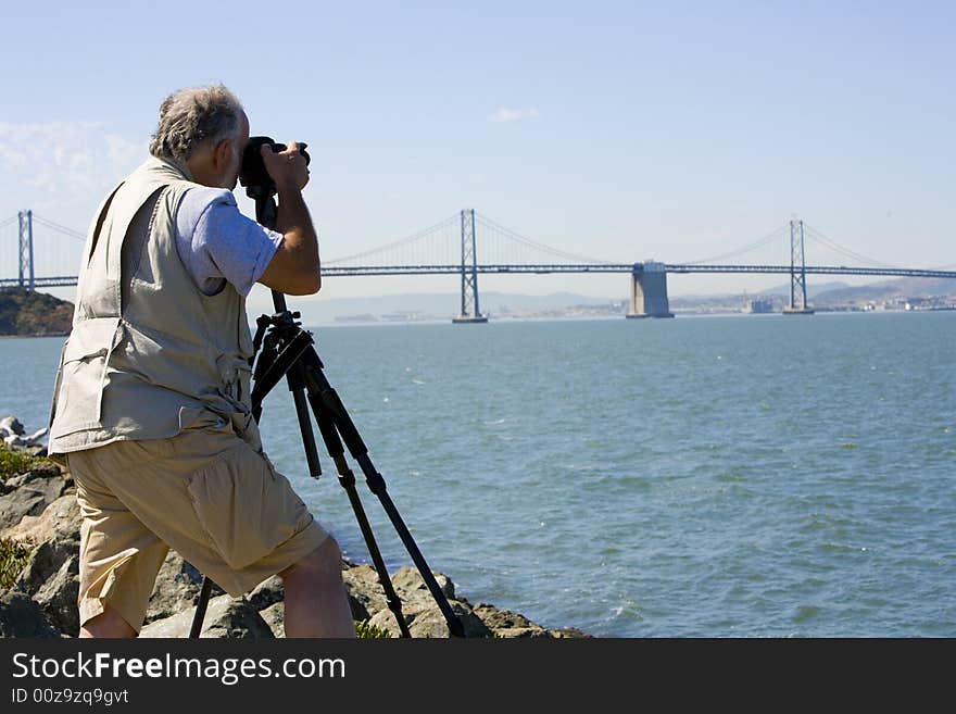 Photographer focusing his camera