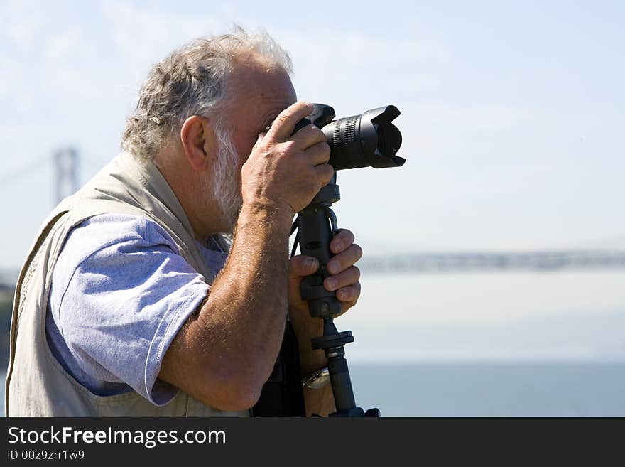 Photographer focusing his camera