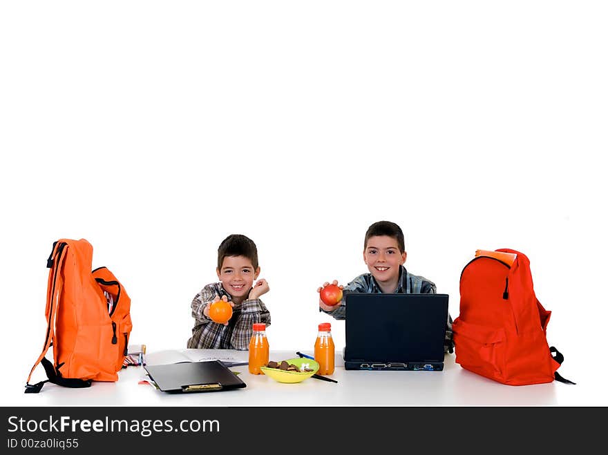 Two young boys doing together studying and homework. Two young boys doing together studying and homework