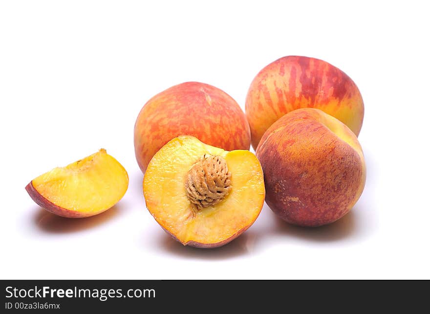 Fresh peachs on white background