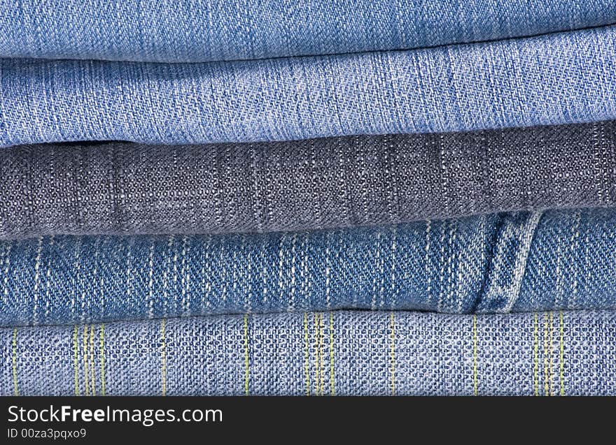 A pile of jeans in shades of blue