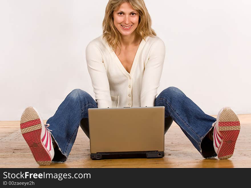 Beautiful young woman with laptop computer