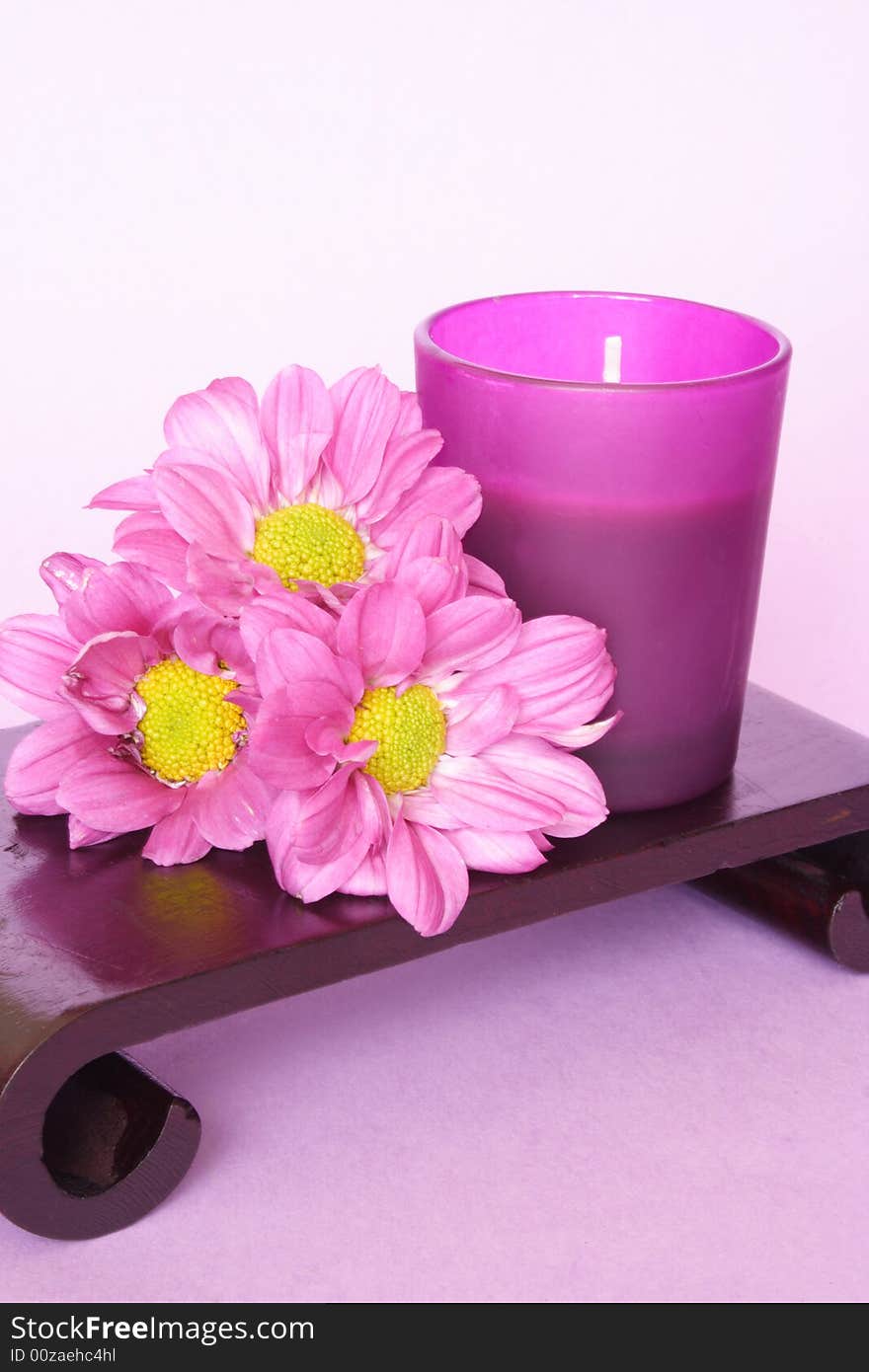 Calm color of candle and bunch of flowers. Calm color of candle and bunch of flowers