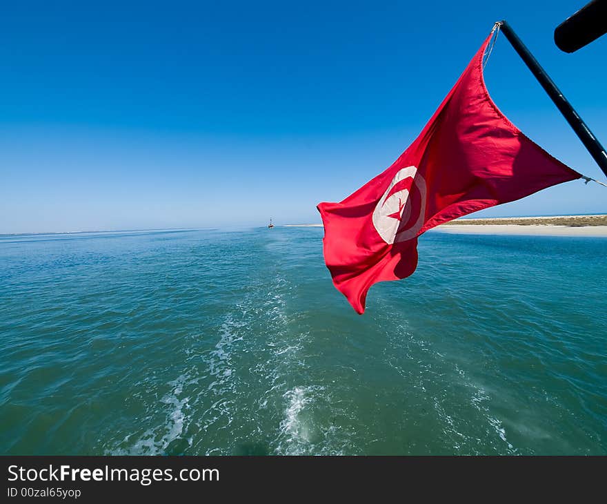 Tunisian flag waving on the ship. Tunisian flag waving on the ship