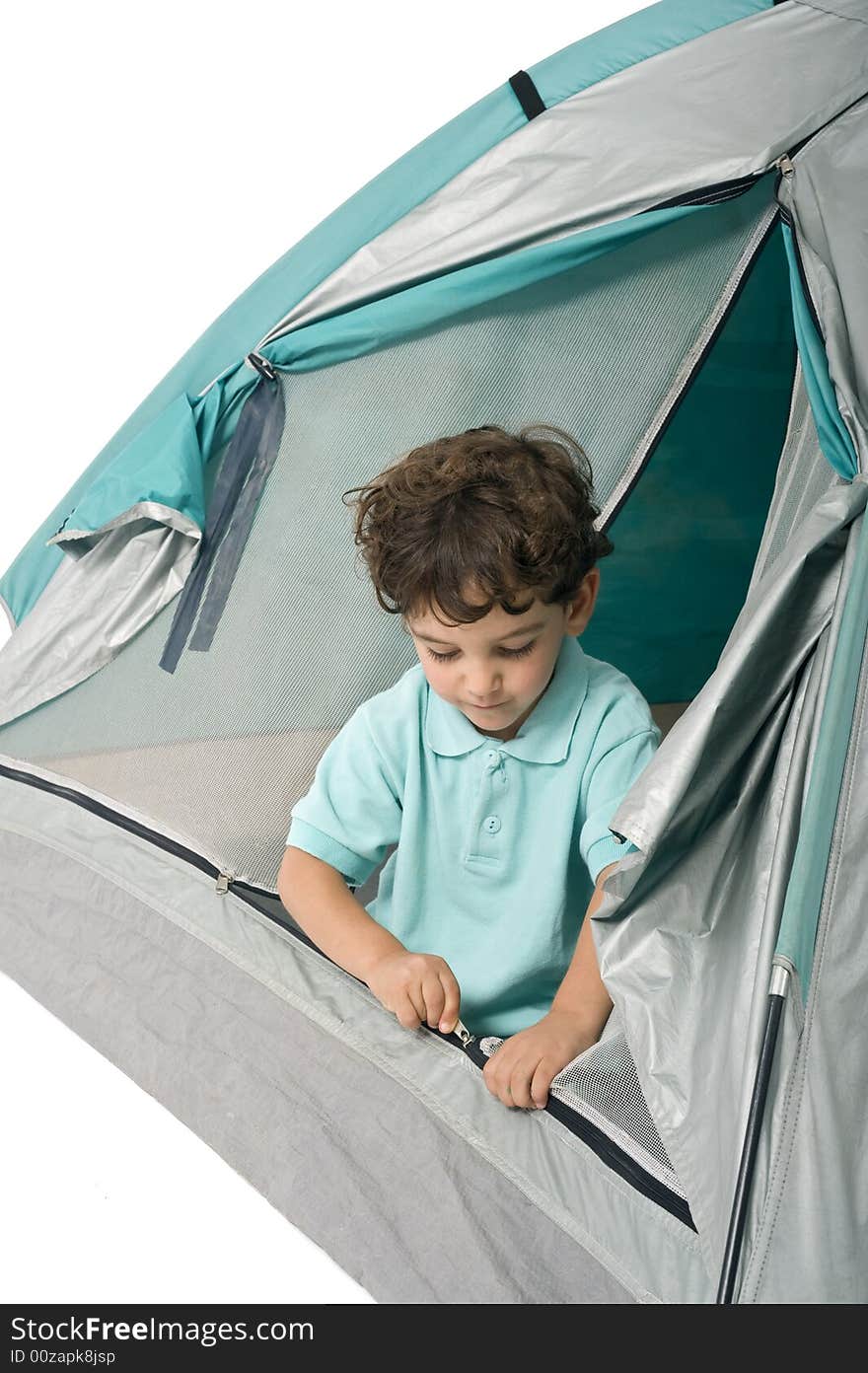 Young boy in a tent isolated on white