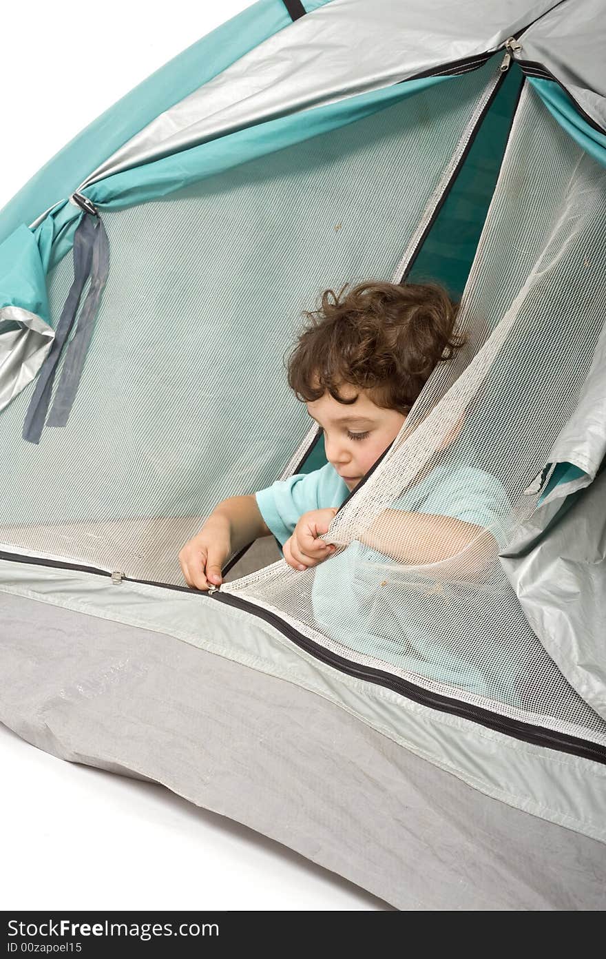 Young boy in a tent isolated on white