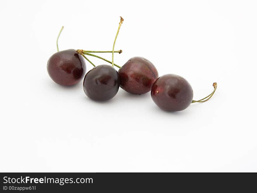 Four Big mature Cherry on white background. Four Big mature Cherry on white background