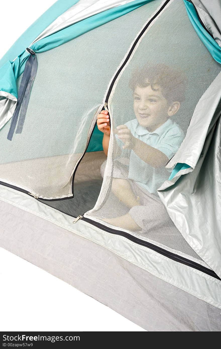 Young boy in a tent isolated on white