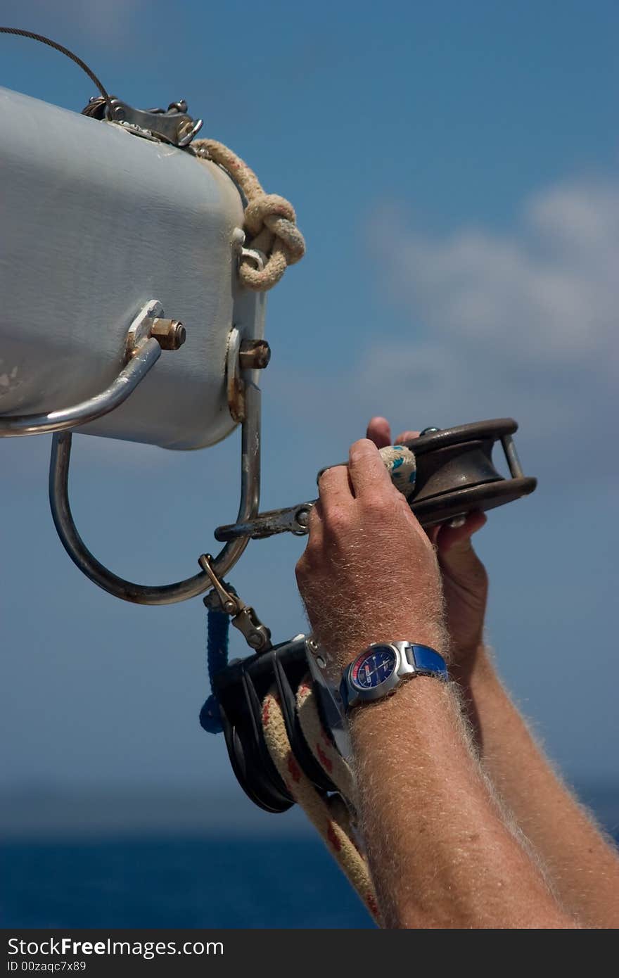 Fixing a rope on a sailboat. Fixing a rope on a sailboat