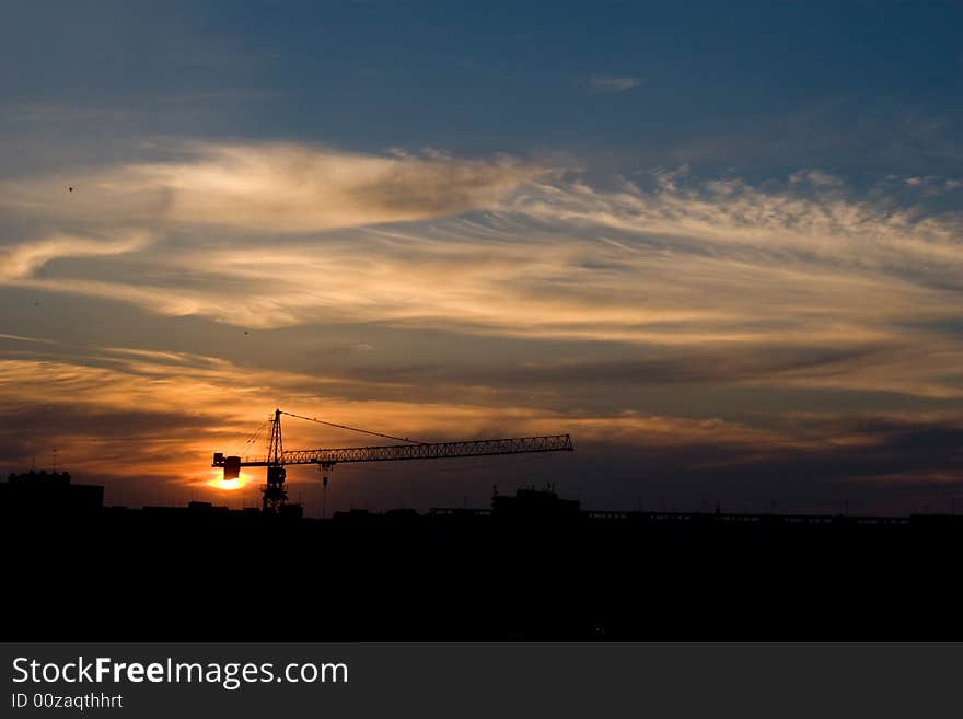 City sunset sky over a big crane. City sunset sky over a big crane