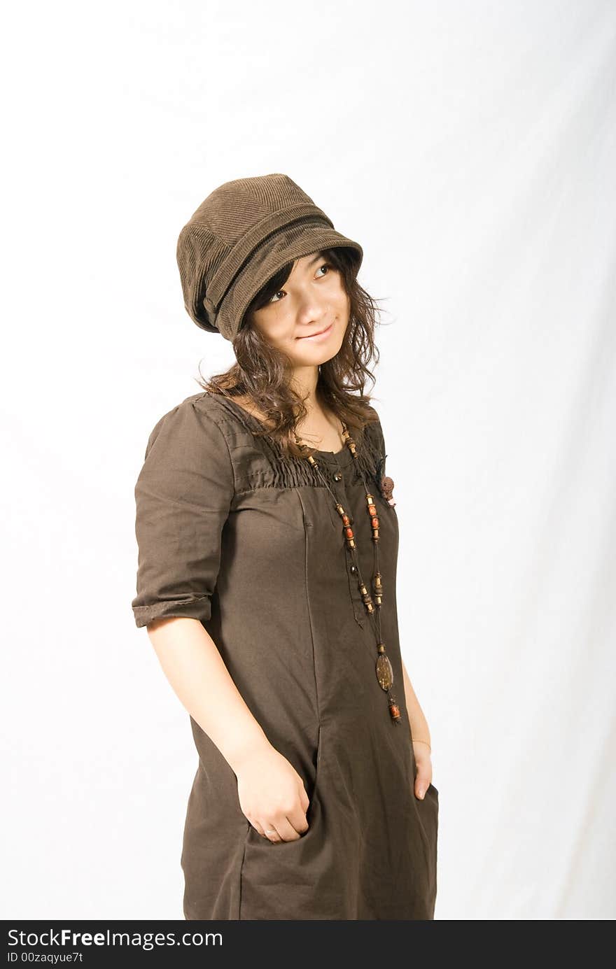 A cute asian girl wears a brown hat which fit her face and hair very well!. A cute asian girl wears a brown hat which fit her face and hair very well!