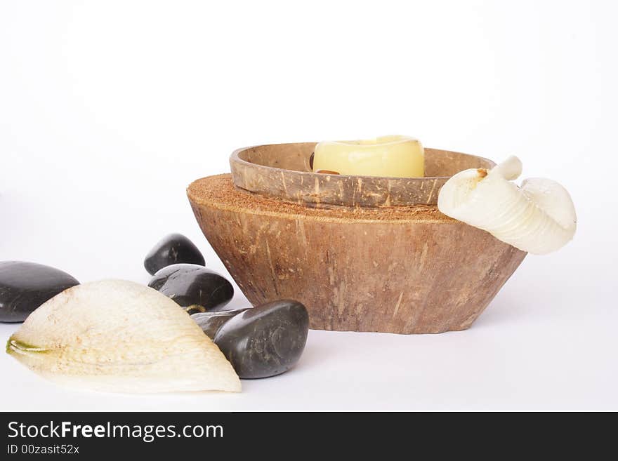 Coconut lit candle with spa items isolated. Coconut lit candle with spa items isolated