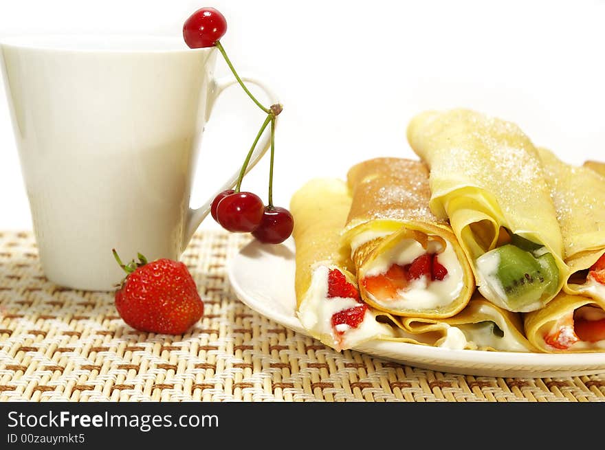 Pancakes filled, berries and cup