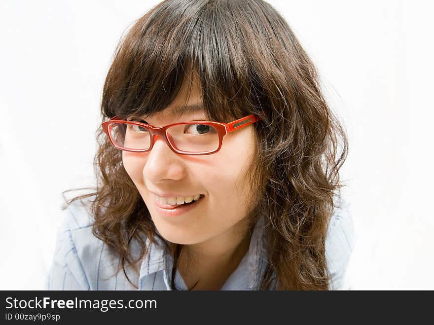 A very cute girl wearing red frame glass and light blue shirt