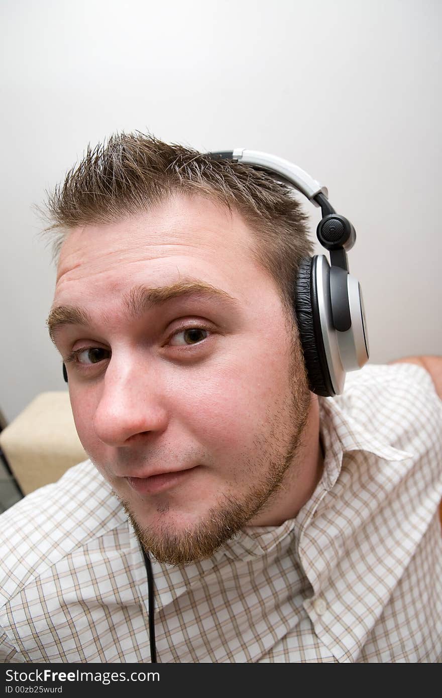 Casual man with headphones on white background. Casual man with headphones on white background