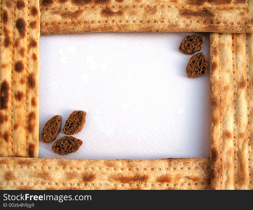 A frame of matzo with crackers on the light background. Macro