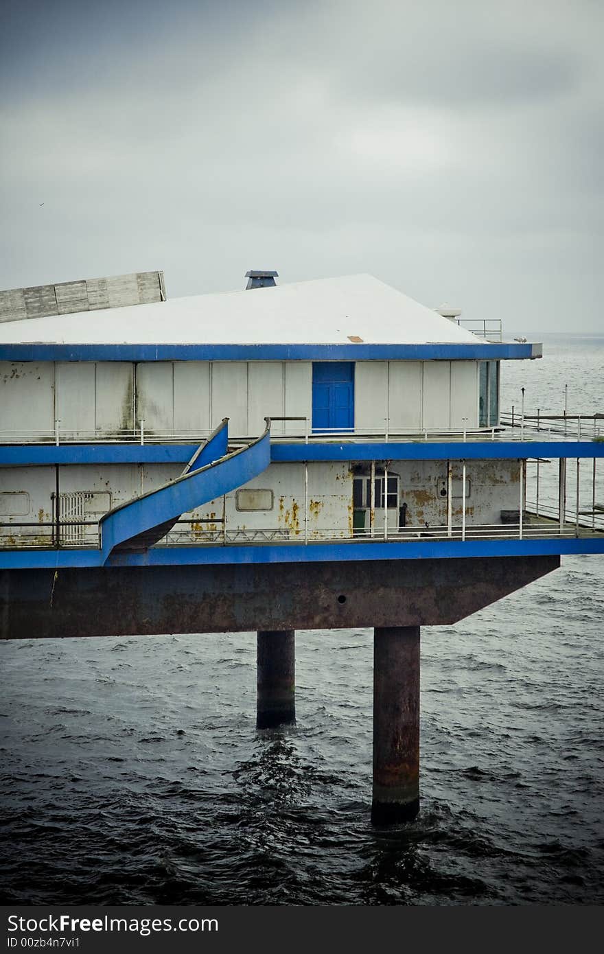 Deserted platform on the ocean, with overcast sky. Deserted platform on the ocean, with overcast sky.