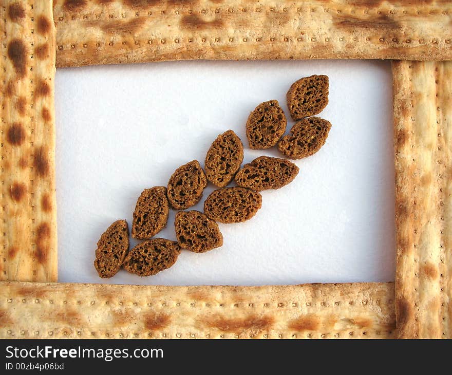 A frame of matzo with crackers on the light background. Macro