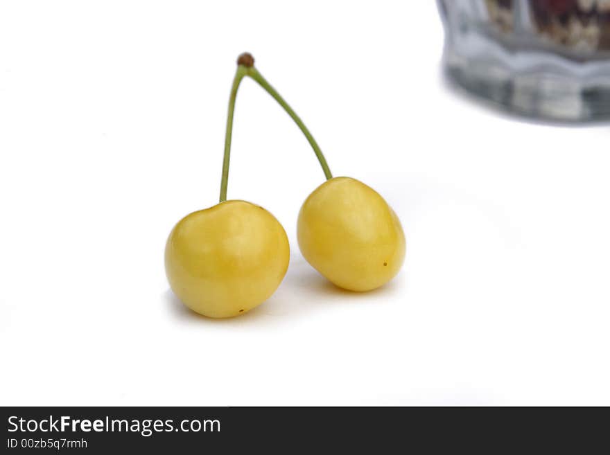 Pair to ripe yellow sweet cherries. Pair to ripe yellow sweet cherries