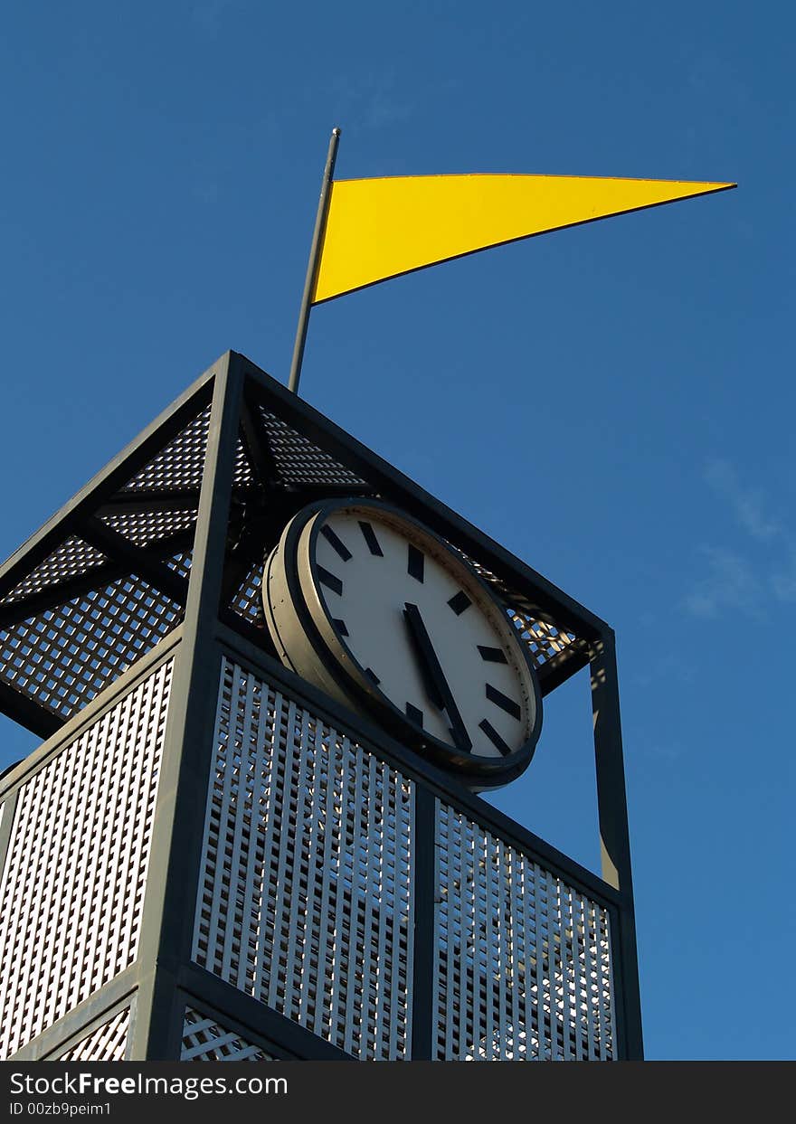 Steel turret with flag and clock. Steel turret with flag and clock